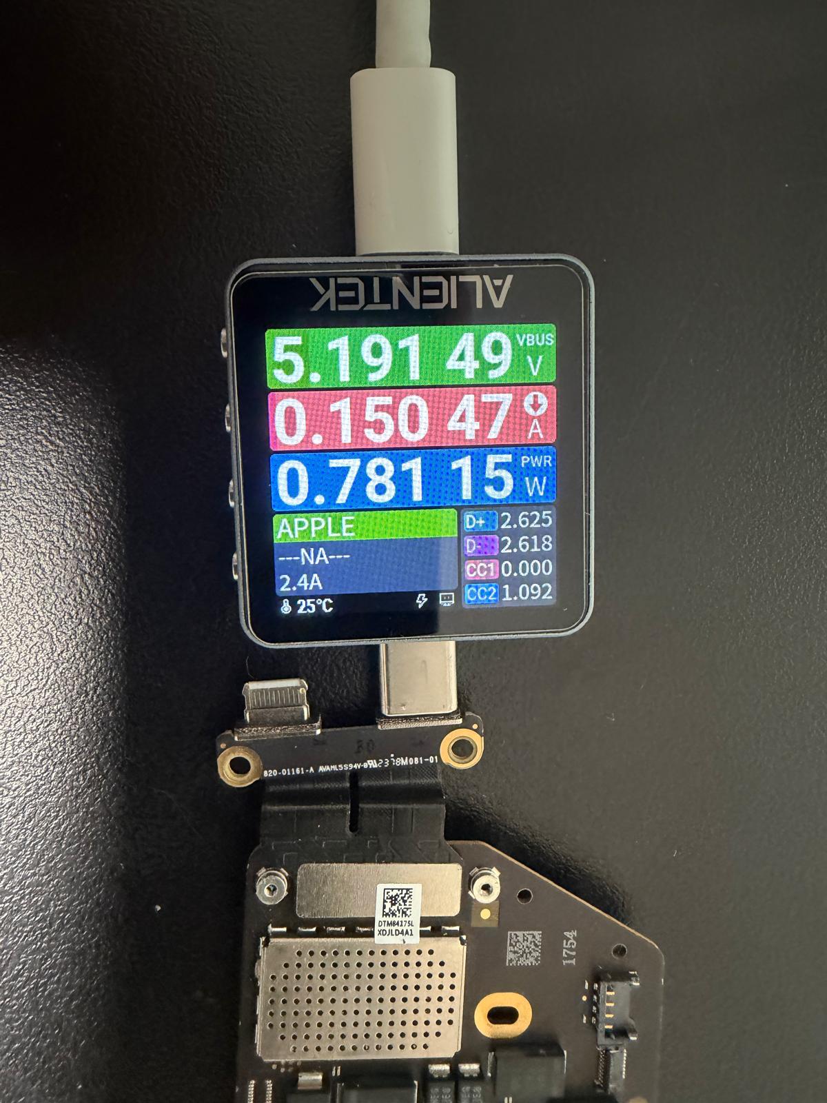 USB-C power meter showing a low-power reading during MacBook A3429 diagnosis